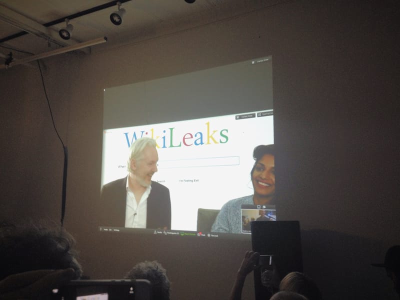 Julian Assange and M.I.A. walk into an arcade